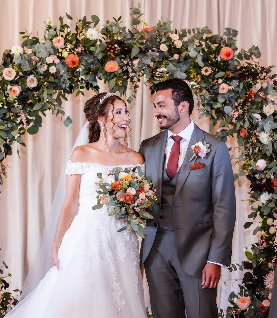 romantic photo of bride and groom looking at each other after they said I do at the wedding ceremony