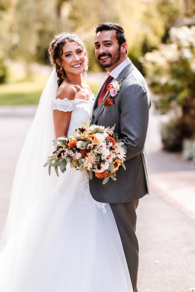 formal portrait photo of bride and groom in the garden at Clock Barn in Hampshire