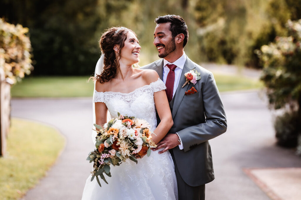 relaxed and romantic photo of bride and groom looking at each other and having fun 