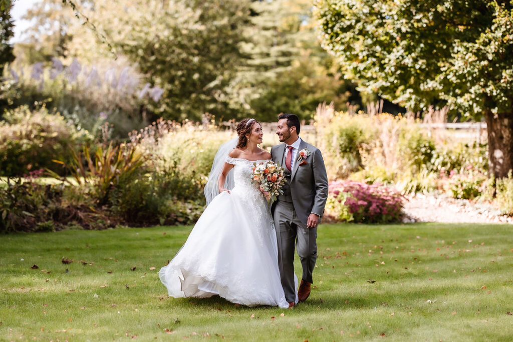 wedding couple walking in the garden 