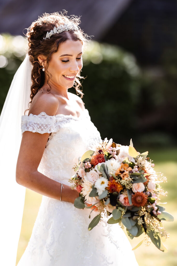 romantic and natural photo of bride holding her flowers