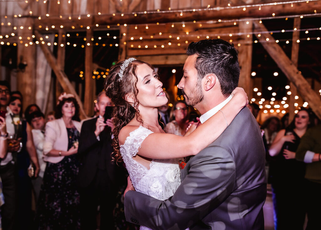 bride is dancing with her groom 