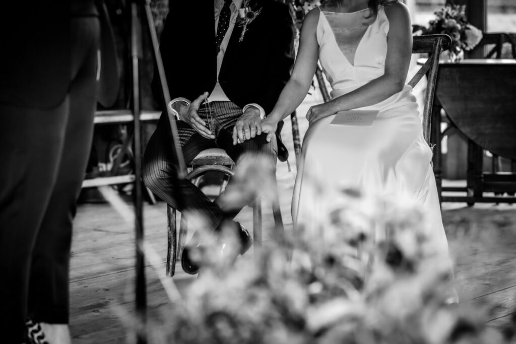 romantic details of hands of bride and groom during the wedding ceremony in Wilsthire