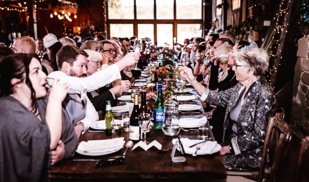 Candid photos of wedding guests during the wedding reception at the rustic Wilshire wedding barn