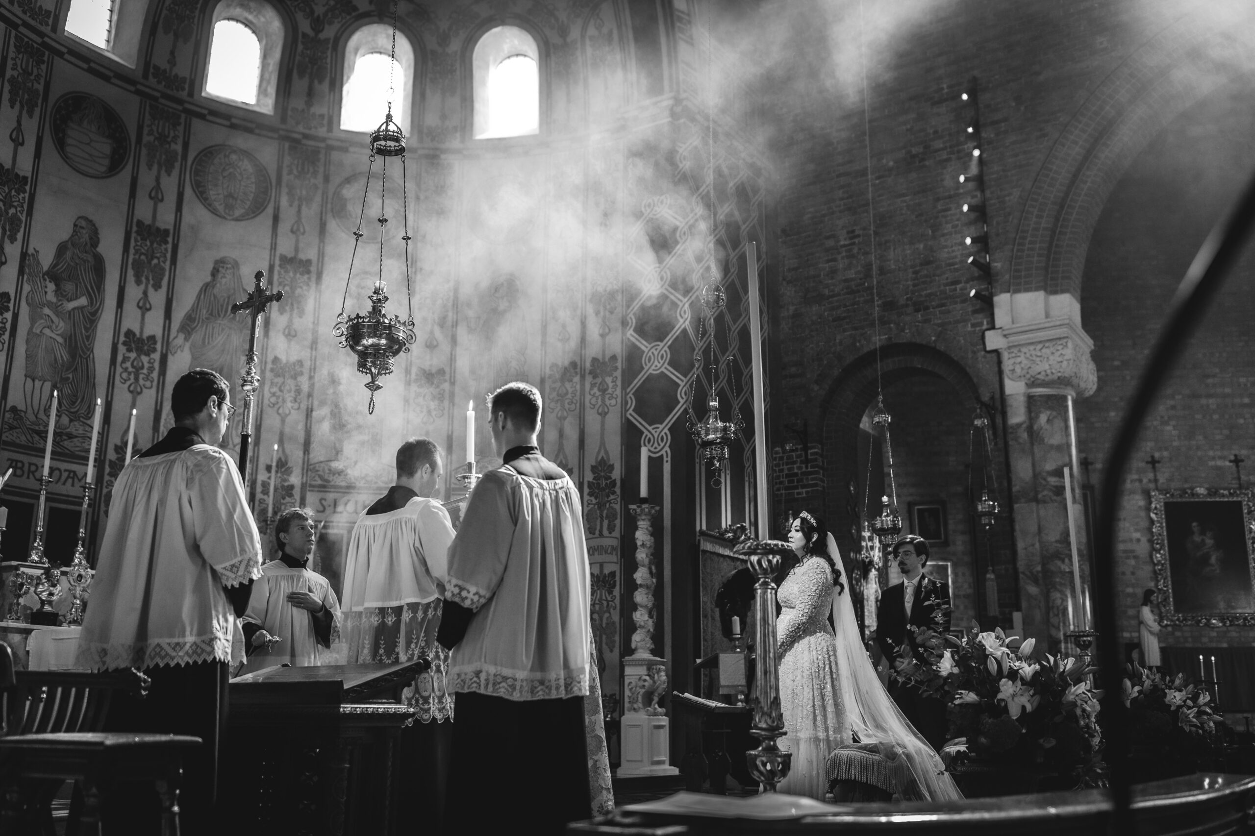 dramatic moody photo of bride and groom at the church wedding ceremony