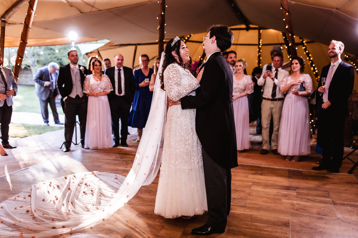 bride and groom's first dance at marquee