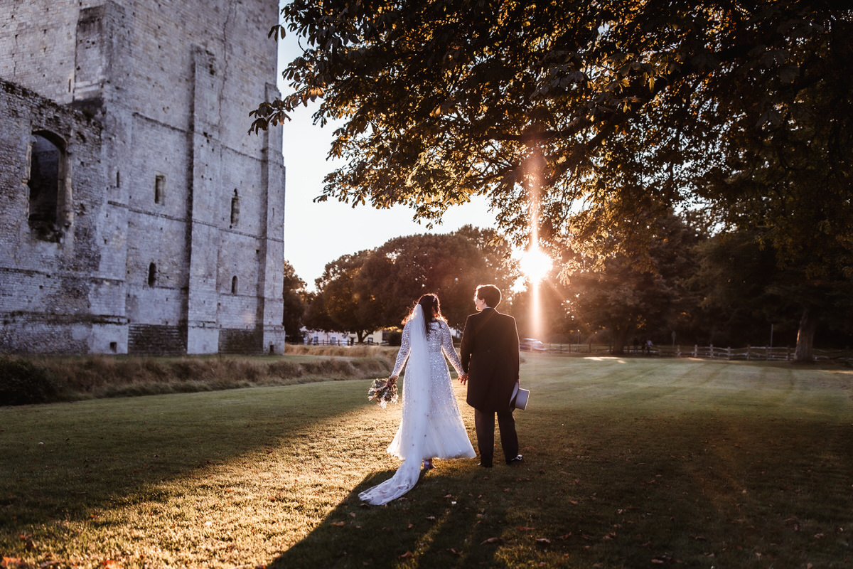 bride and groom walking during the sunset in Porchester Hampshire